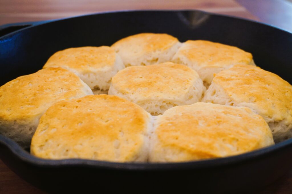 cooked biscuits in a cast iron skillet