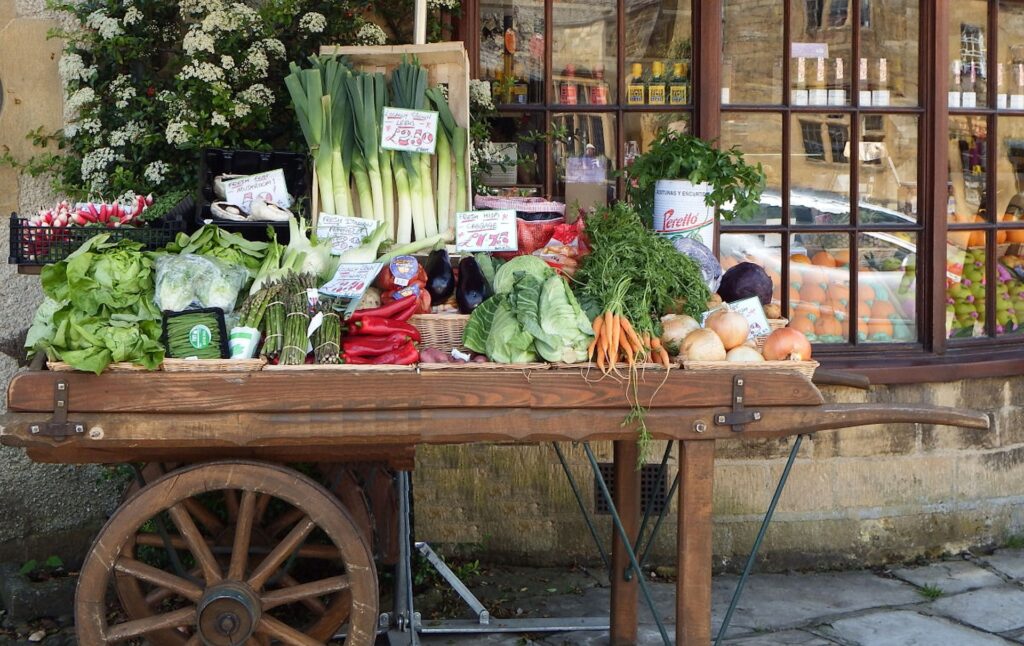 farmers market produce on a wooden cart