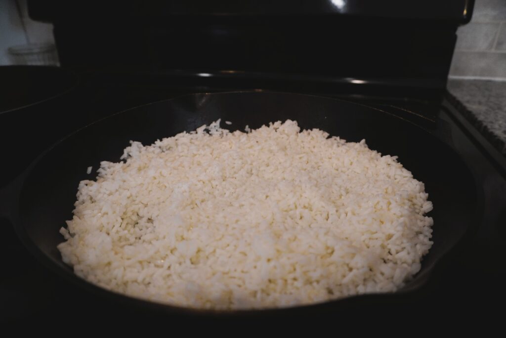 rice cooking in a cast iron skillet