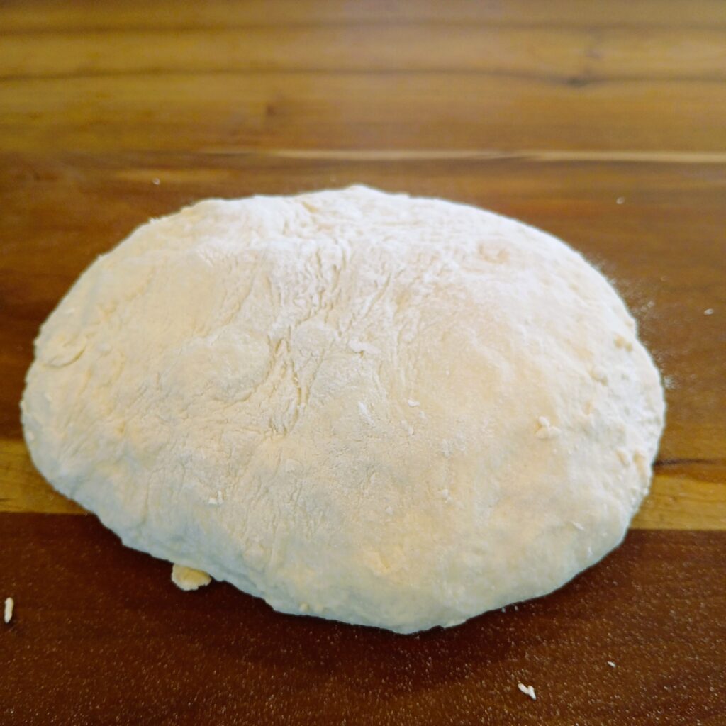 Dough ball on a counter ready to be baked