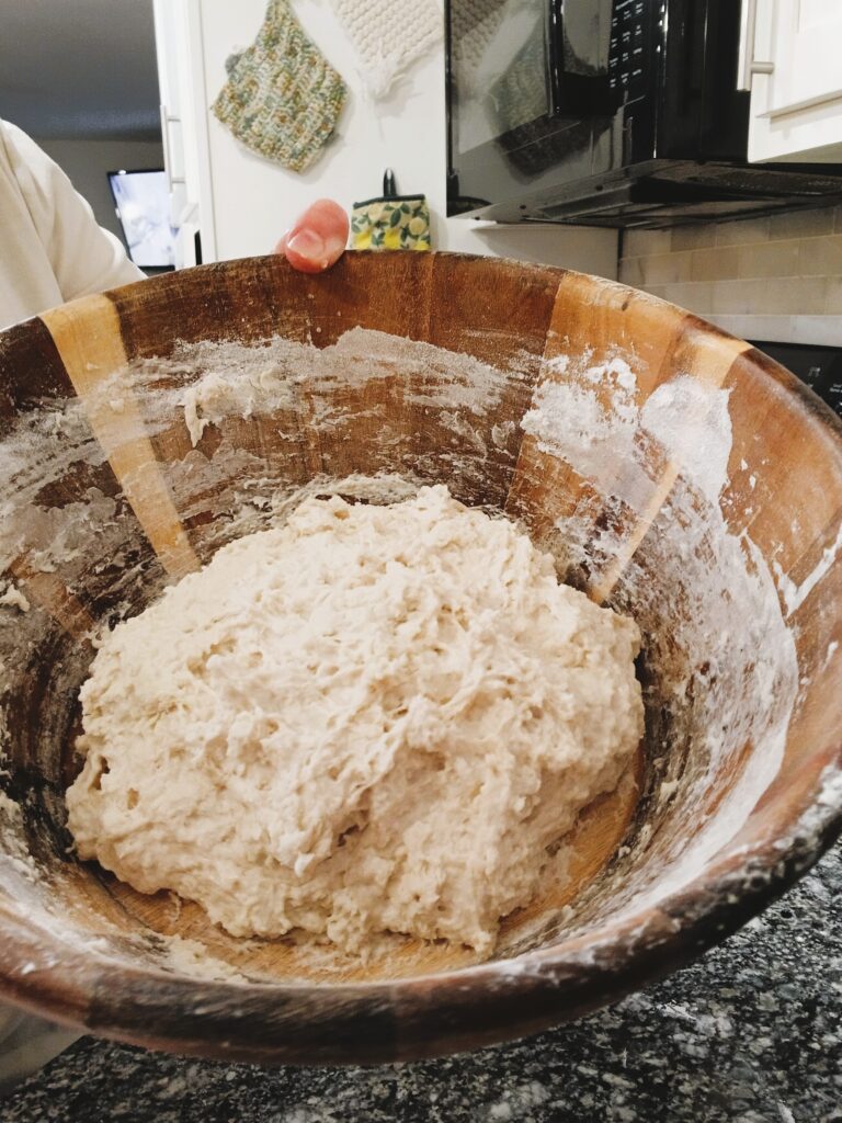 Sticky dough in a wooden bowl for Artisan Bread