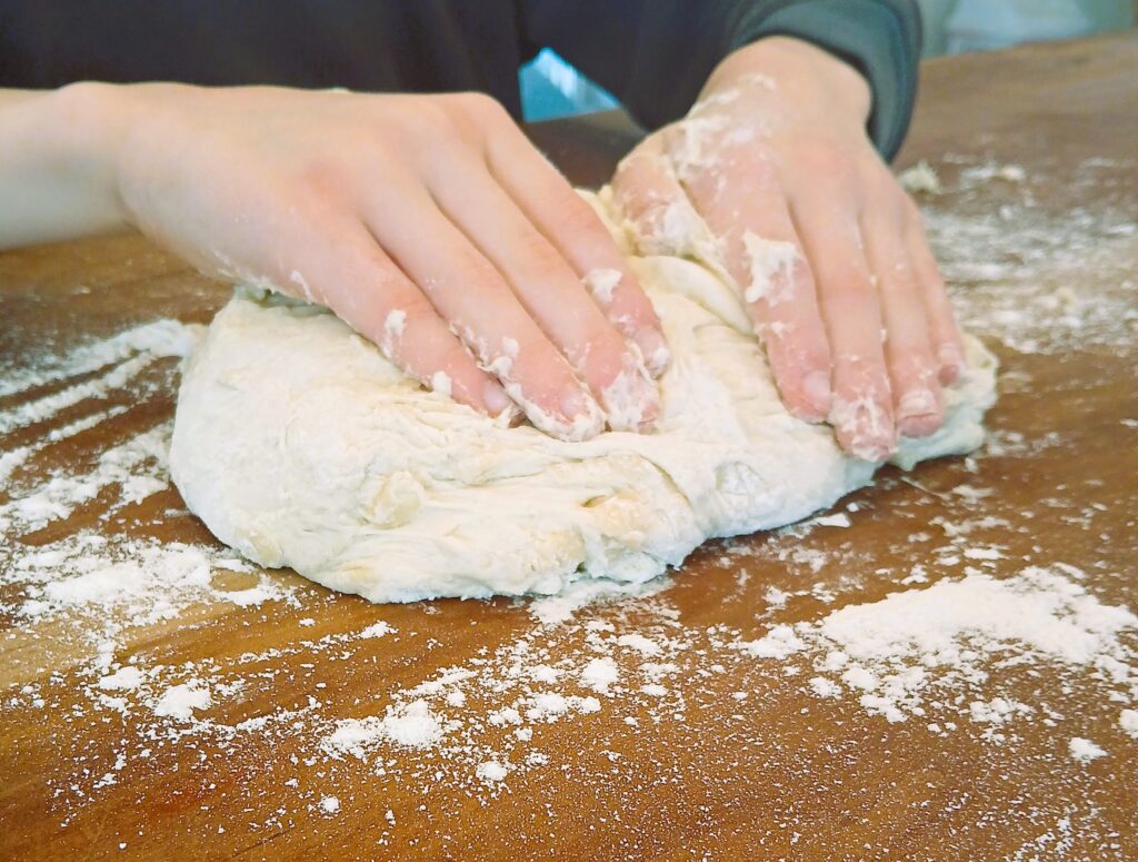 Kneading dough on a counter top