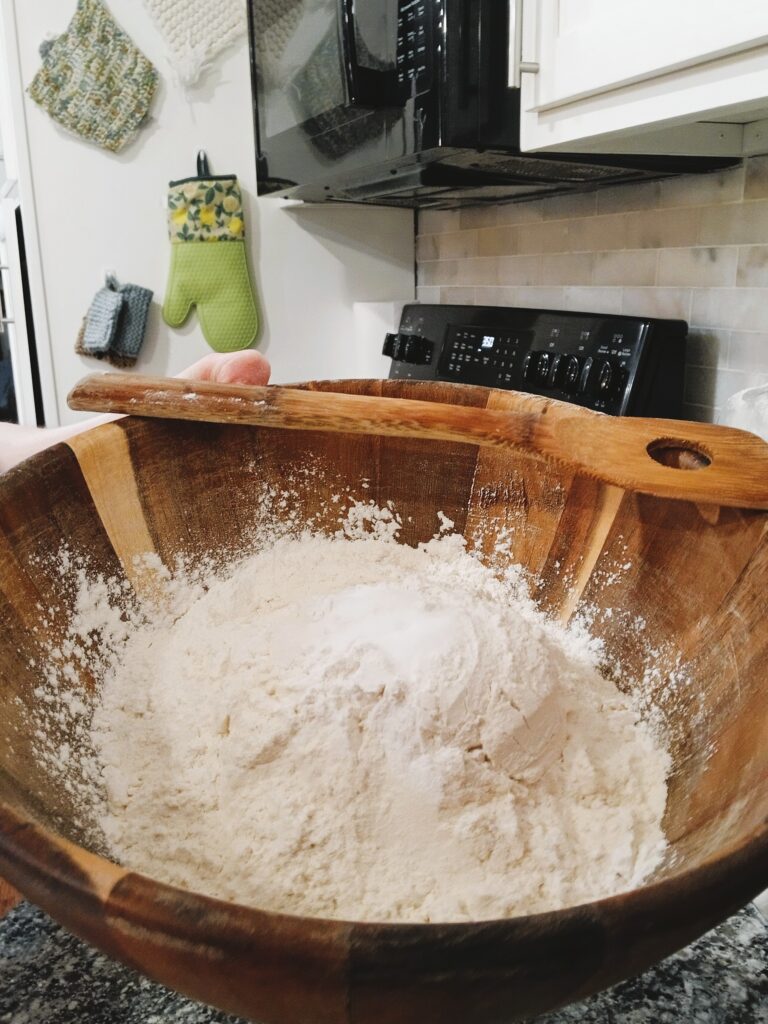 Flour mixture in a wooden bowl for Artisan Bread