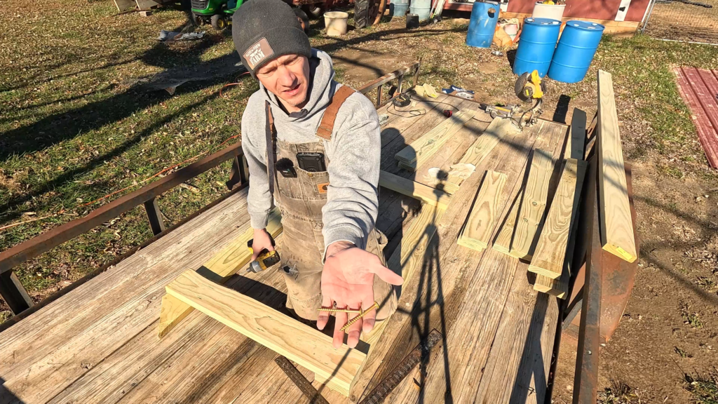 Man showing screws to the camera