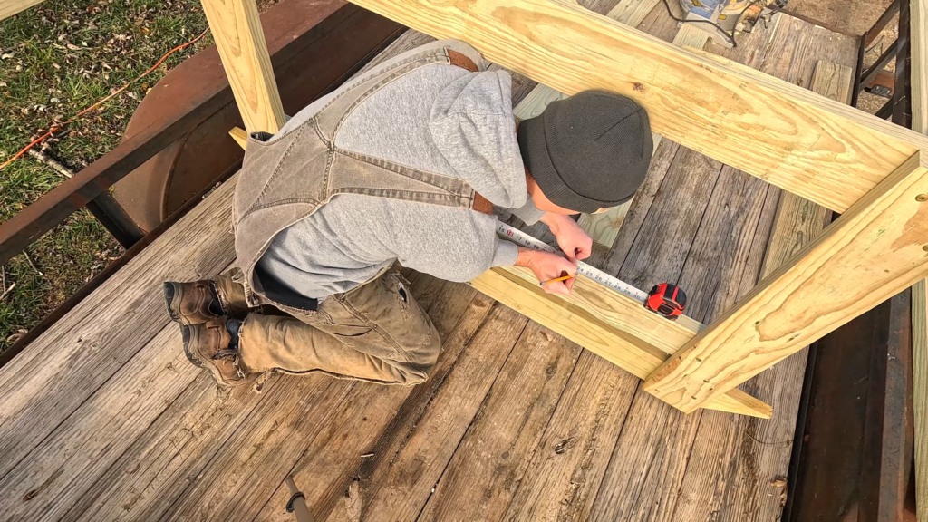 Man measuring feeder