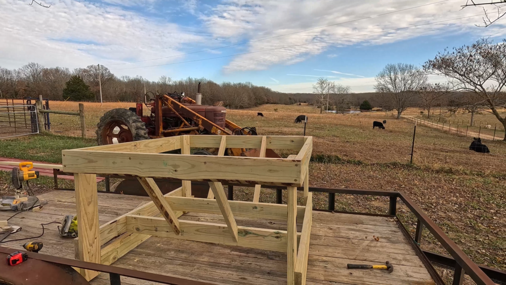 DIY round bale cow feeder on a trailer