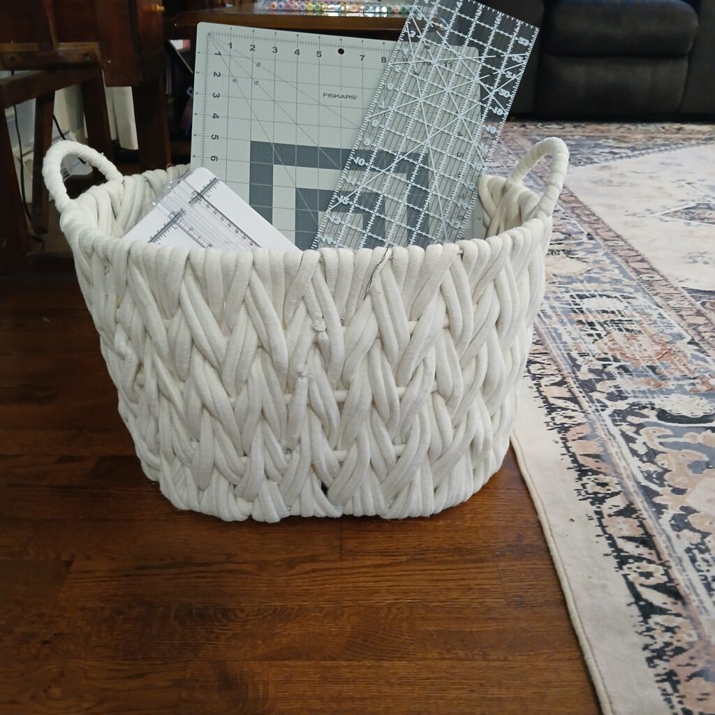 White basket with sewing supplies