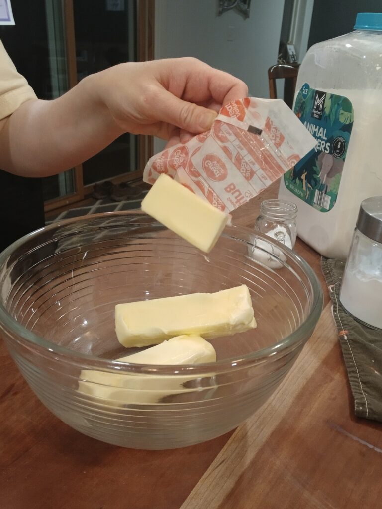 Adding butter to bowl