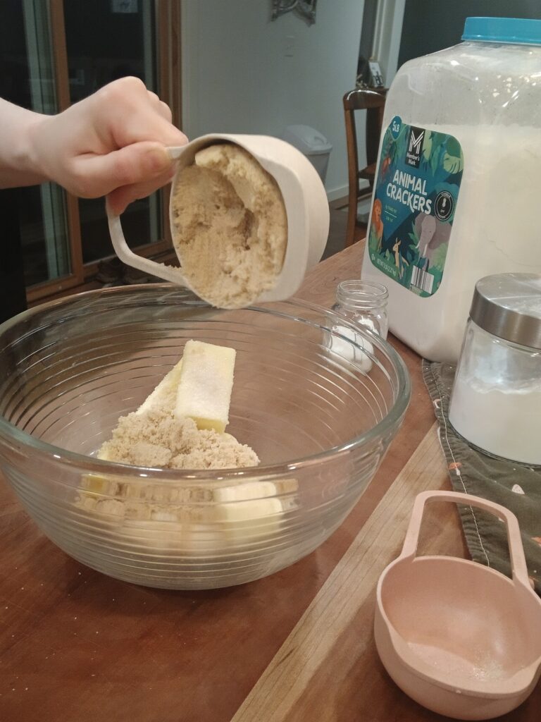 Adding brown sugar to bowl