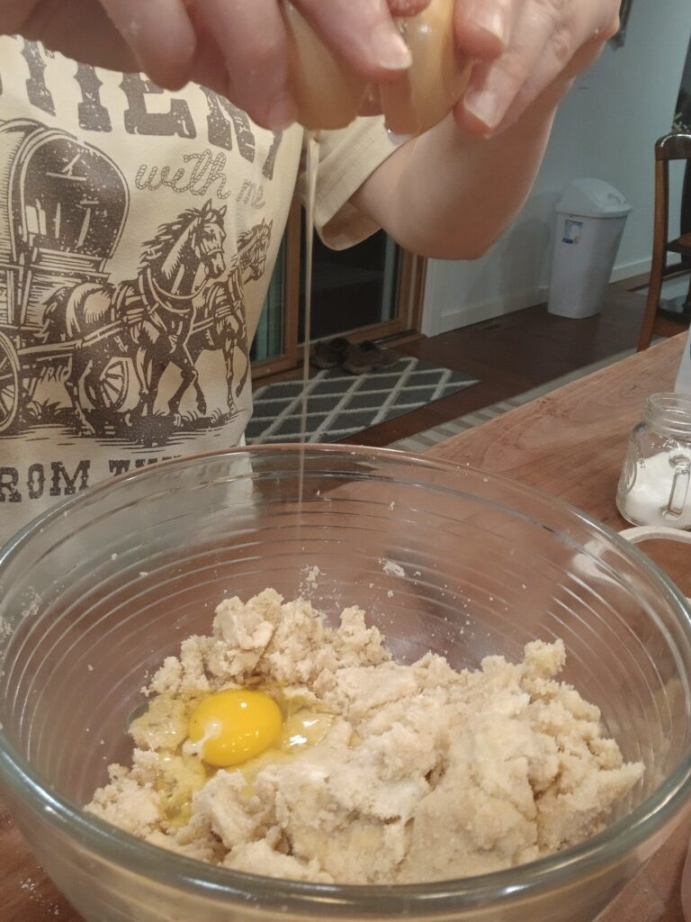 Cracking eggs in bowl
