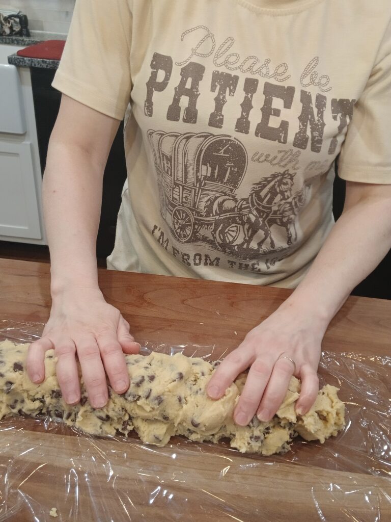 Pressing out log of cookie dough