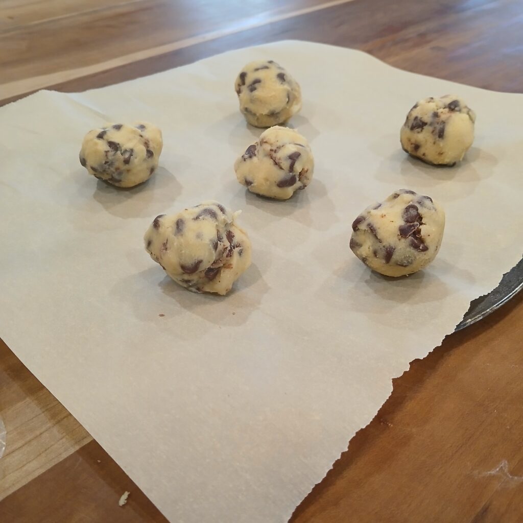 Balls of cookie dough on pan
