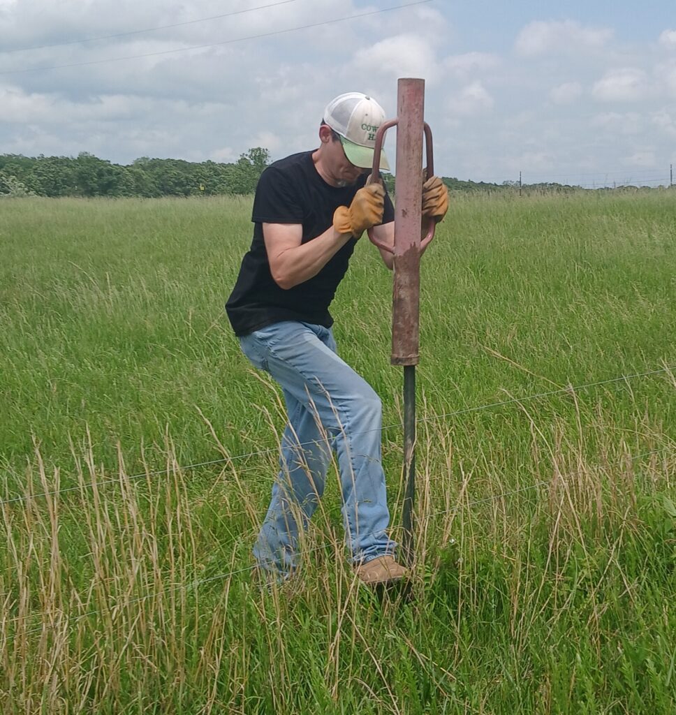Man driving a t post