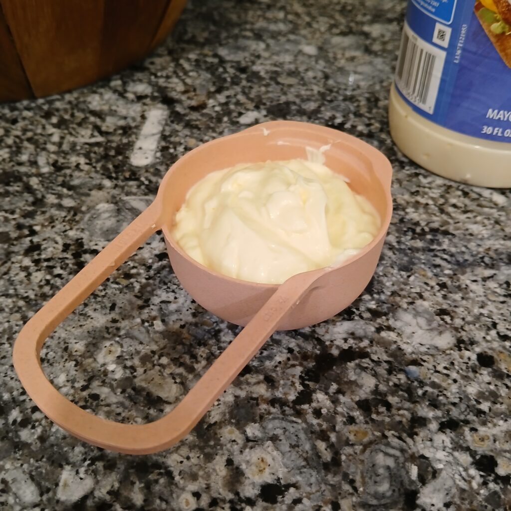 Mayonnaise in a measuring cup