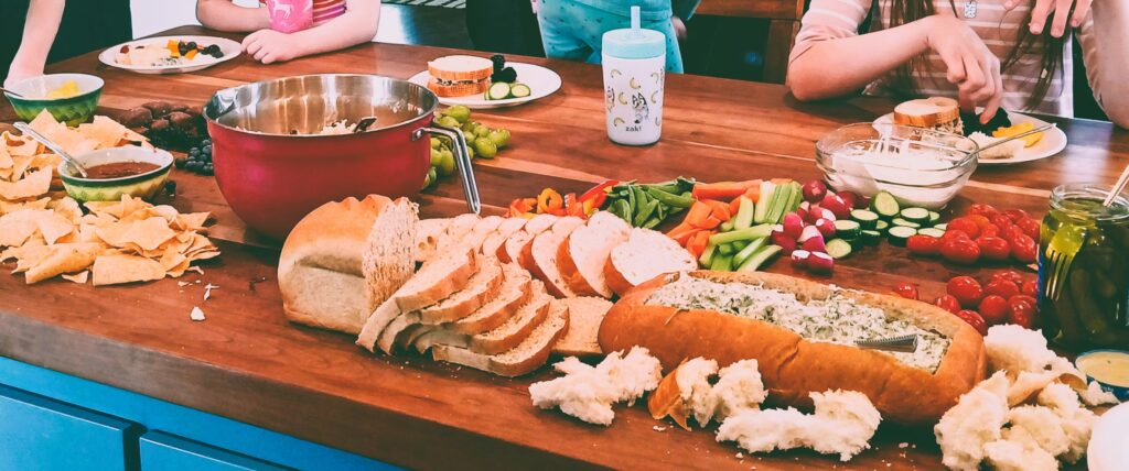 Charcuterie style food on a butcher block island