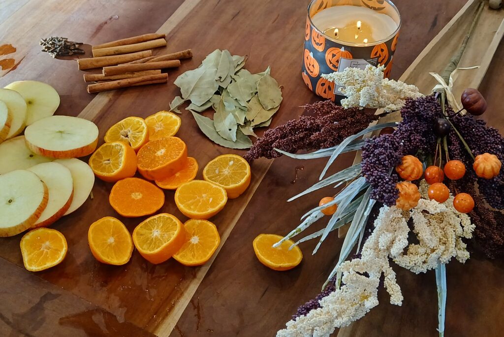 Apples, oranges, and spices on a counter